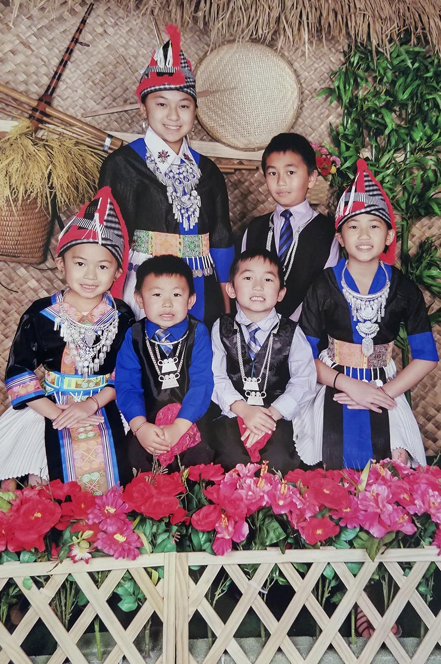 children in White Hmong outfits